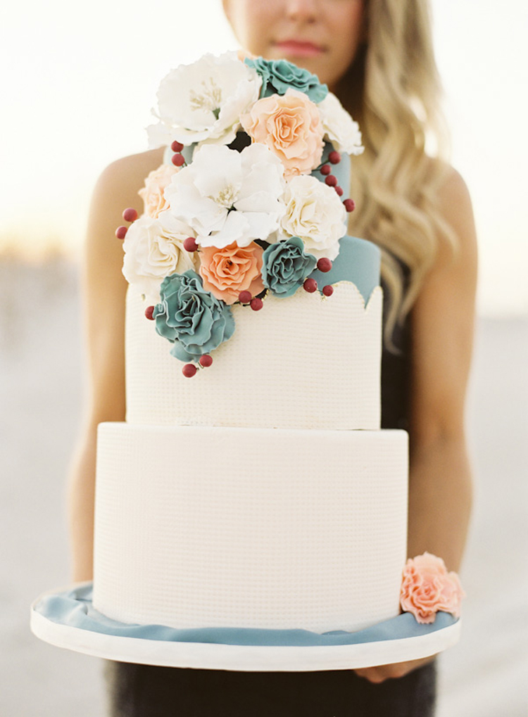 White wedding cake with peach and turquoise blue flowers | See more: http://mysweetengagement.com/15-extraordinary-wedding-cakes-for-all-wedding-styles