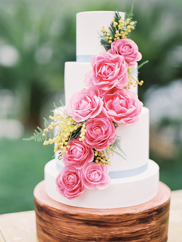 White wedding cake with beautiful cascading pink flowers | See more: http://mysweetengagement.com/15-extraordinary-wedding-cakes-for-all-wedding-styles