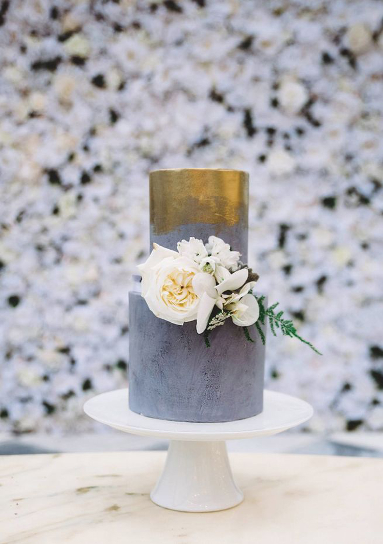 Metalic gold and grey wedding cake with white flowers | See more: http://mysweetengagement.com/15-extraordinary-wedding-cakes-for-all-wedding-styles