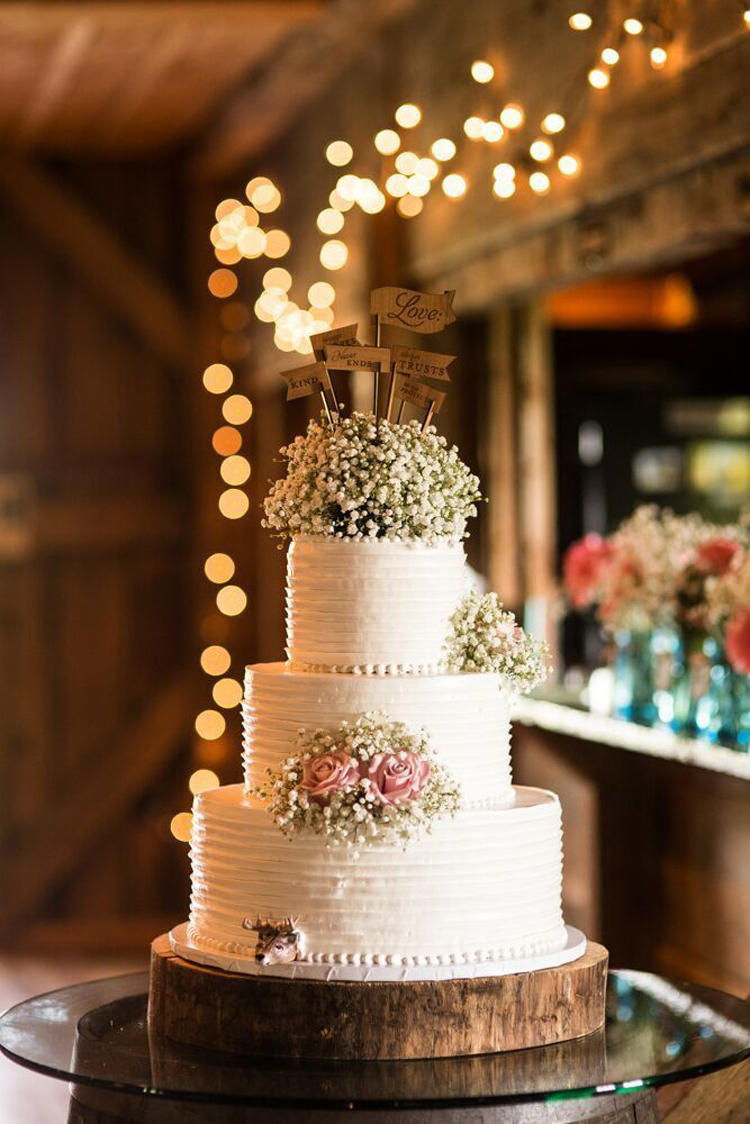 Romantic and rustic wedding cake with baby's breath topper | See more: http://mysweetengagement.com/15-extraordinary-wedding-cakes-for-all-wedding-styles