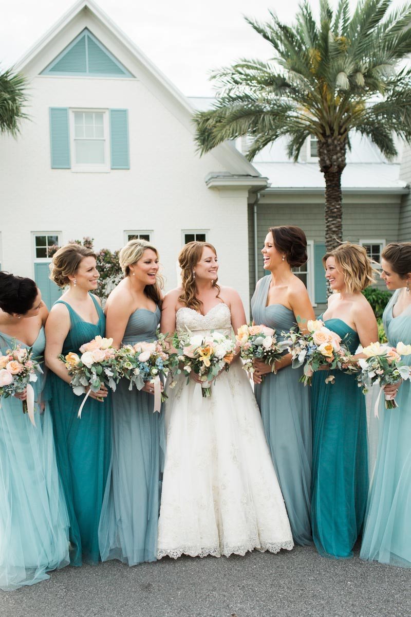 These bridesmaid dresses in shades of blue are as pretty as the ocean. What a lovely ombre effect. // See more: Mix It Up: 15 Mix and Match Bridesmaid Dresses Done Right // http://mysweetengagement.com
