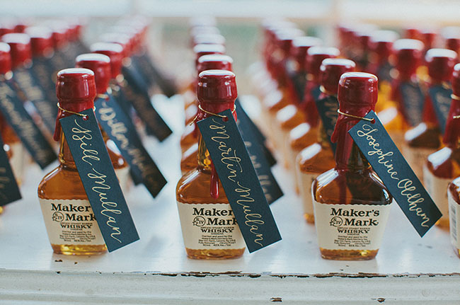 How adorable are there mini whisky bottles escort card and favors? // Wedding favor ideas your guests will love