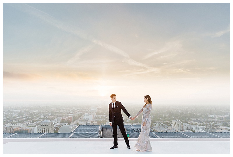 Obsessed about how romantic this rooftop sunset looks. Magical sky. Jana Williams Photography // Don't know what to wear for your engagement pictures? Check out these 10 Formal Engagement Photo Outfit Ideas. // http://mysweetengagement.com