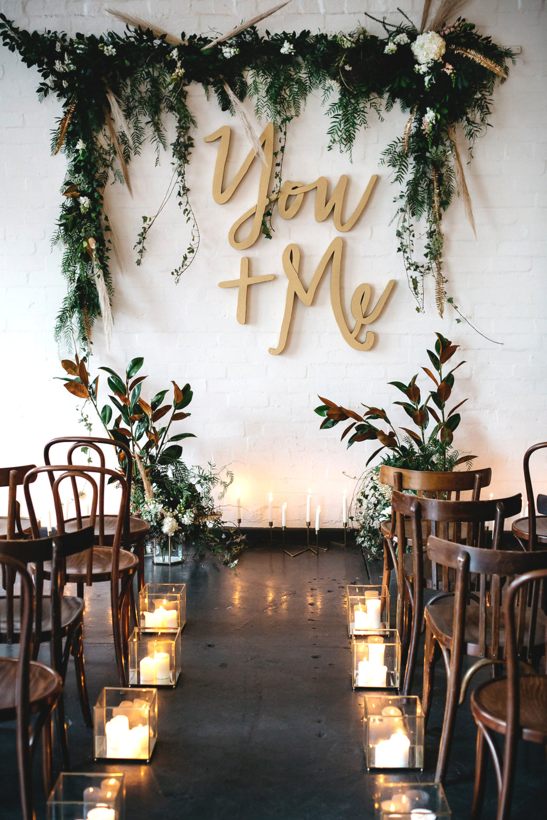 Industrial Indoor Wedding Ceremony Using Geometric Candle Holder to Decorate the Aisle. // 15 Stunning Ways to Decorate with Candles // http://mysweetengagement.com