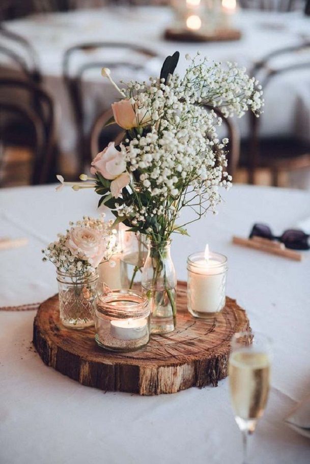 Rustic and modest Wedding Centerpiece Decoration Idea with Wood Board, Candle and Baby's Breath // 15 Stunning Ways to Decorate with Candles // http://mysweetengagement.com