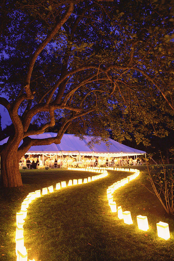 Reception entrance guided by candle lights. // 15 Stunning Ways to Decorate with Candles // http://mysweetengagement.com