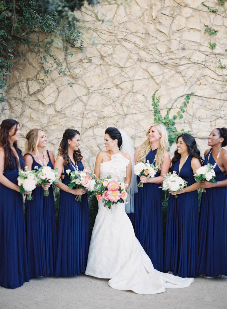 Mix and match bridesmaid dresses on the navy blue color - one shoulder and V neck. 