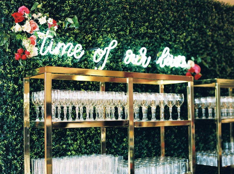 "Time of our lives" beautiful wedding reception bar decor sign with neon lettering // Fun and bright neon wedding sign decor ideas // mysweetengagement.com