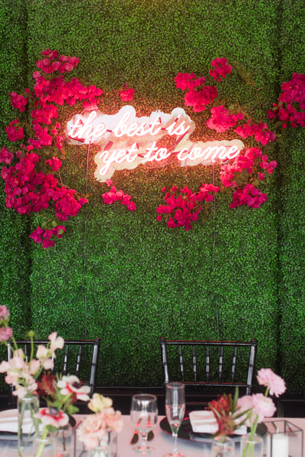 Because "The best is yet to come". Romantic neon sign lettering. With pink flowers it is the perfect accent to a green wall backdrop. // Fun and bright neon wedding sign decor ideas // mysweetengagement.com