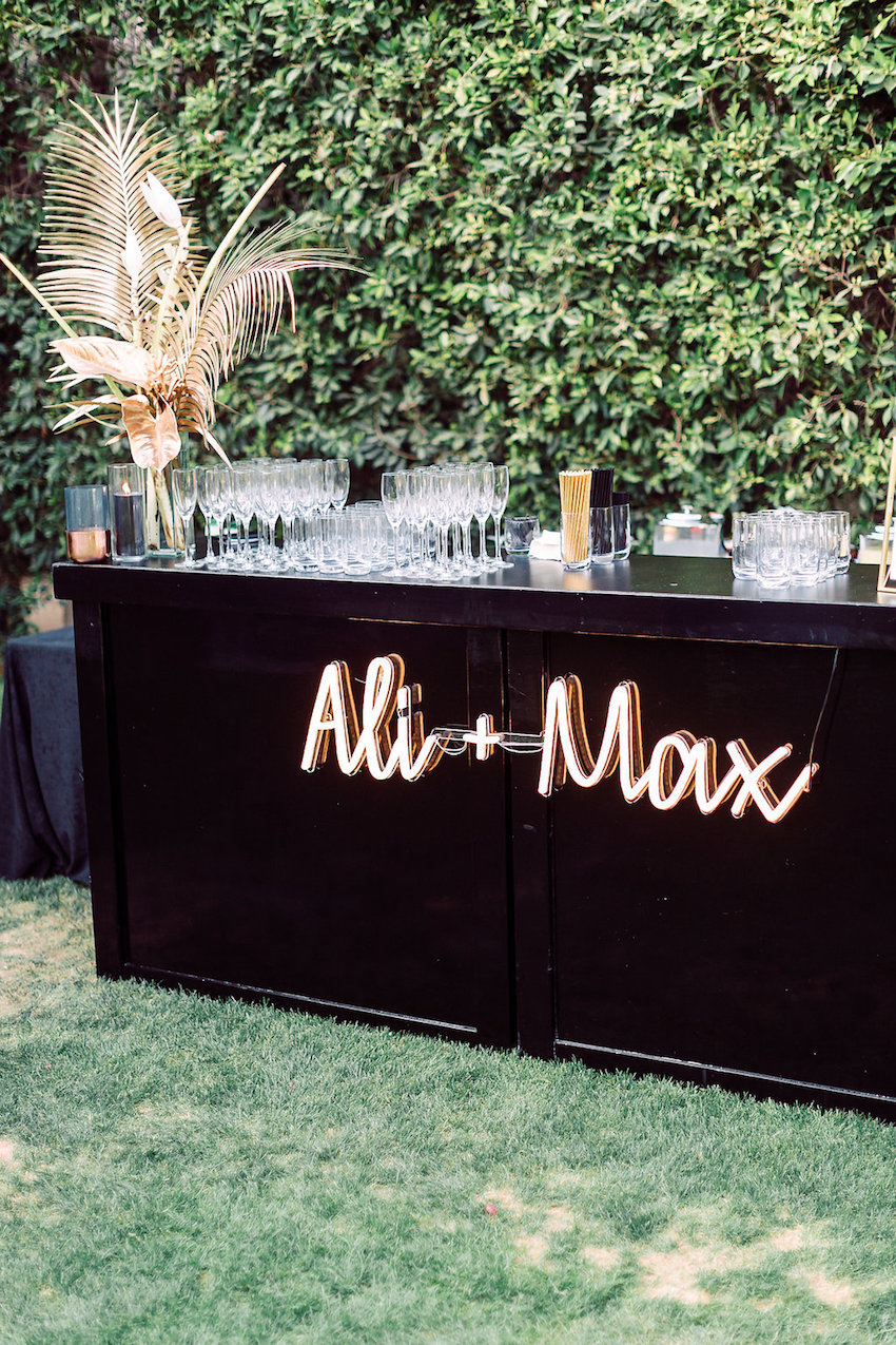 Personalize your wedding with the bride and groom names on awesome neon signs like this one on the reception bar. // Fun and bright neon wedding sign decor ideas // mysweetengagement.com
