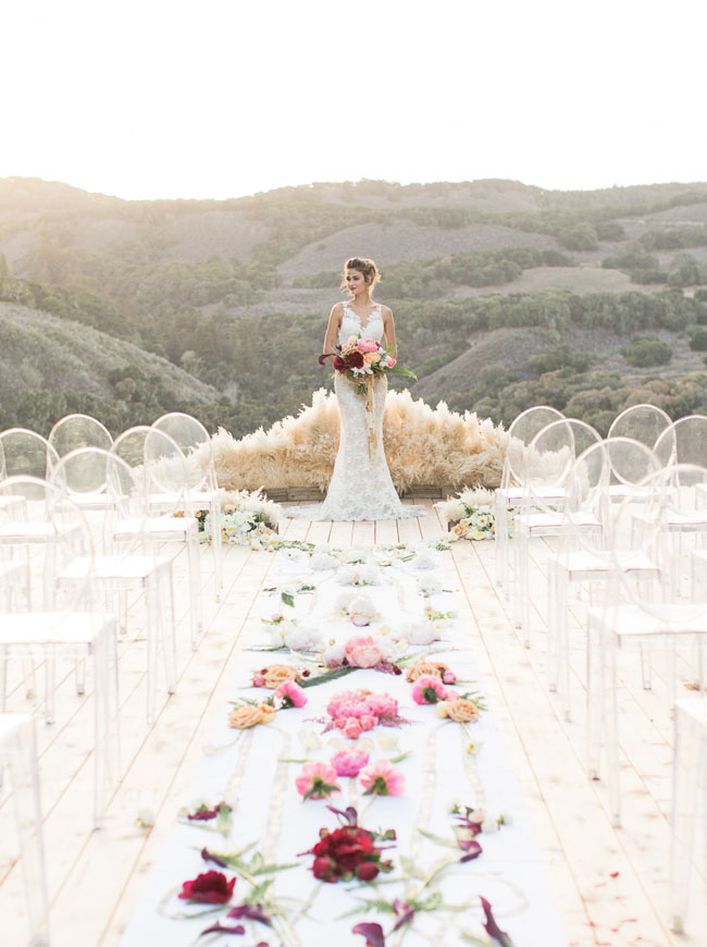 Modern affair: Acrylic wedding decor and ideas. Minimalist outdoor wedding ceremony with perspex ghost-chairs and low pampa grass altar. // mysweetengagement.com
