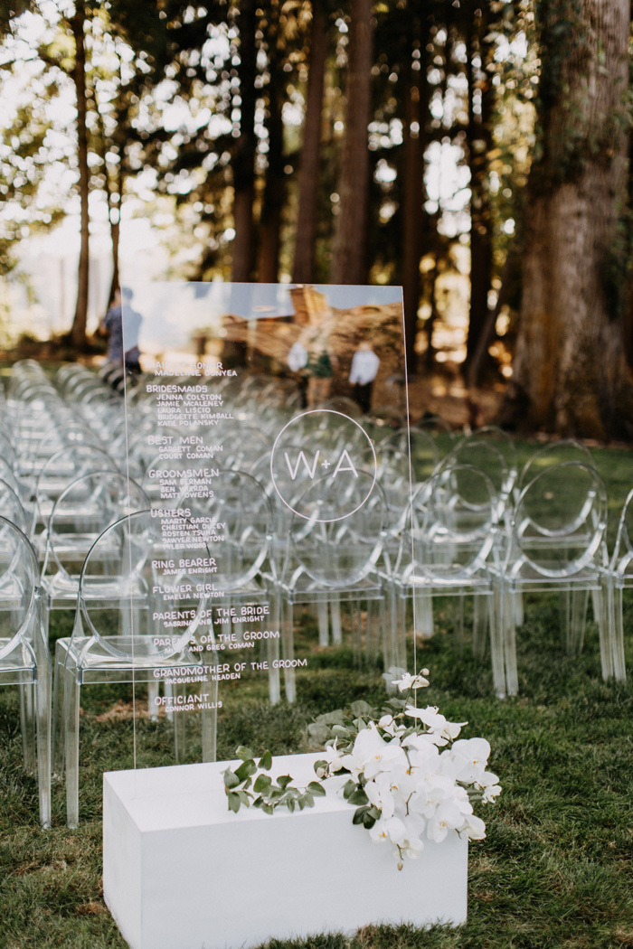 Modern affair: Acrylic wedding decor and ideas. White ceremony decor with perspex wedding party sign and ghost chairs. // mysweetengagement.com