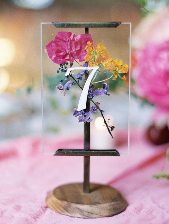 Modern affair: Acrylic wedding decor and ideas. Perspex and wood table number sign with colorful pressed flowers. // mysweetengagement.com