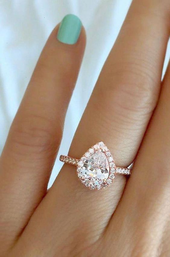 Pear shaped (teardrop) engagement ring ideas: delicate rose gold ring with halo. // mysweetengagement.com