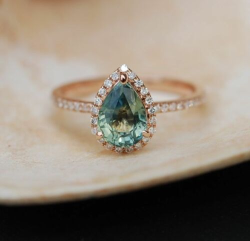 Pear shaped (teardrop) engagement ring ideas: Rose Gold Engagement Ring Teal Blue Green Sapphire Pear Cut Halo Ring. // mysweetengagement.com