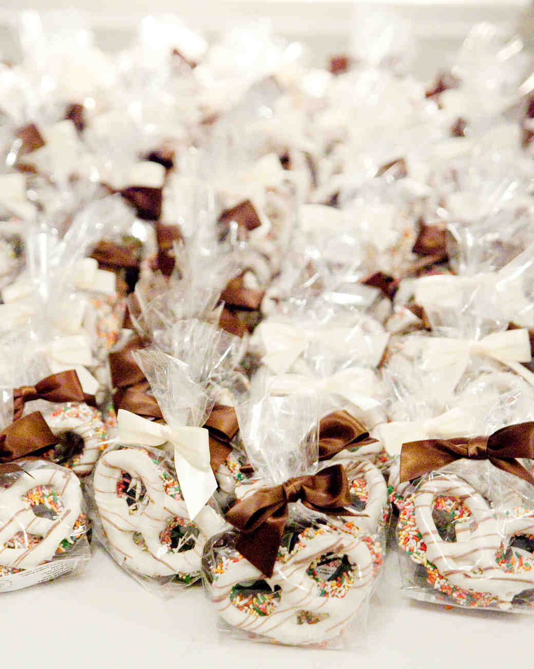 White and milk chocolate-covered pretzels favors. See More Trendy and Creative Ideas to Serve Pretzel on Your Wedding. | My Sweet Engagement
