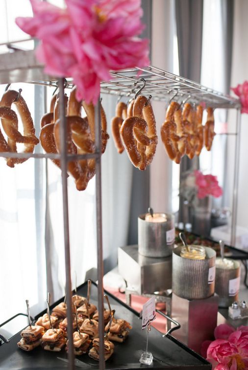 Beautiful hanging pretzel station for an industrial chic wedding reception. See More Trendy and Creative Ideas to Serve Pretzel on Your Wedding. | My Sweet Engagement