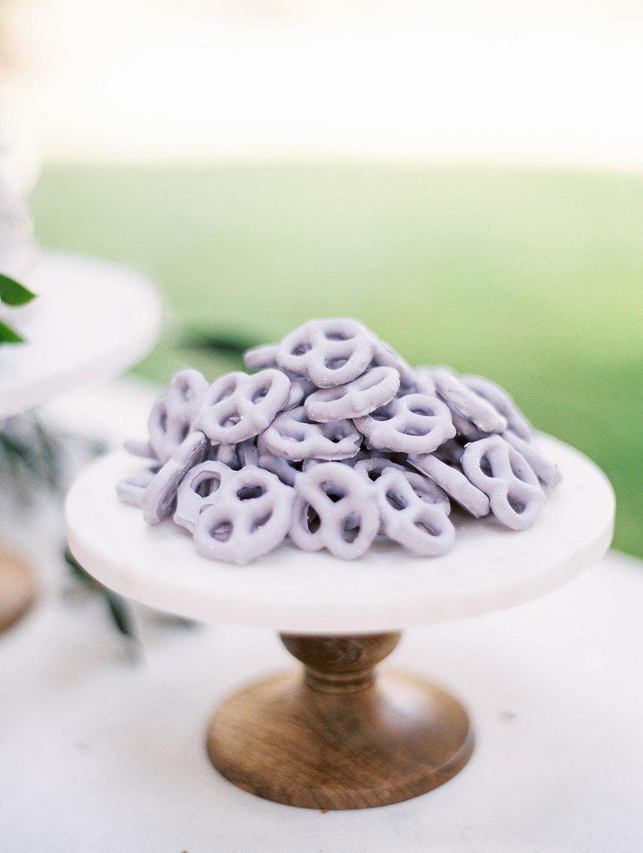 Lavender mini pretzels on cake stand. See More Trendy and Creative Ideas to Serve Pretzel on Your Wedding. | My Sweet Engagement