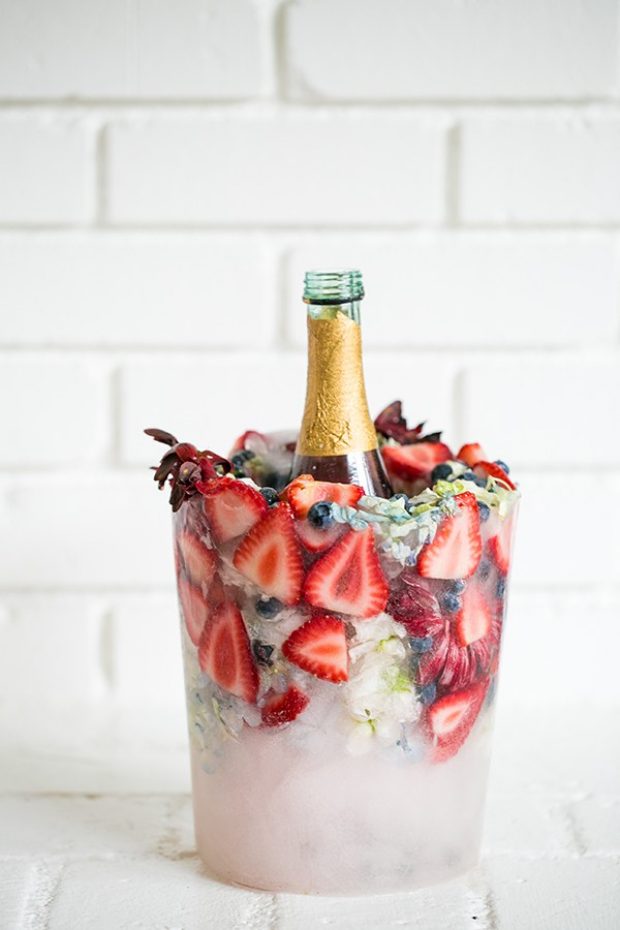 Brilliant idea to cool your party drink with style: DIY floral and fruit ice bucket. // Pin now to read later: How to Slay a Bridal Shower with 10 Epic DIY Ideas // http://mysweetengagement.com 