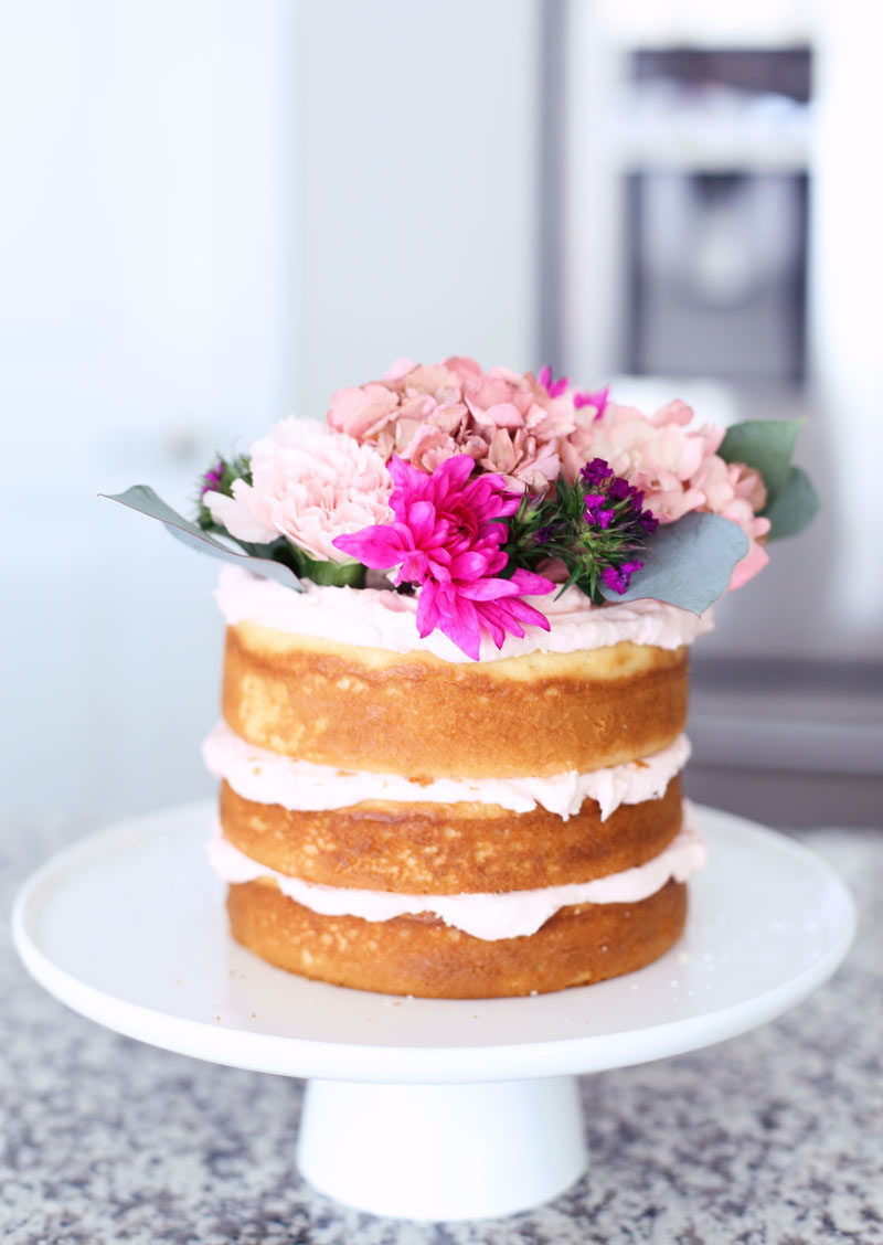 This simple naked cake with floral topper is so beautiful and easy to make! // Pin now to read later: How to Slay a Bridal Shower with 10 Epic DIY Ideas // http://mysweetengagement.com