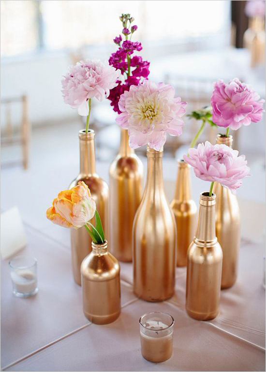 Start collecting used bottles, simply spray paint them and you have a beautiful centerpiece for a bridal shower party or wedding. // Pin now to read later: How to Slay a Bridal Shower with 10 Epic DIY Ideas // http://mysweetengagement.com