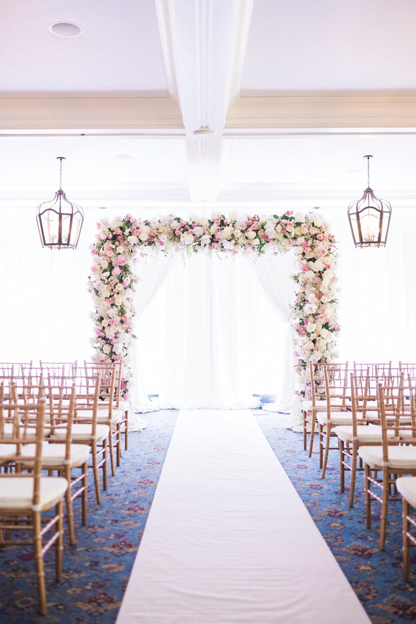 Blush pink flowers and draping backdrops and gold accents will set the perfect tone for a classic and romantic indoor wedding ceremony. // ❤ Check Out These Gorgeous 20 Indoor Wedding Ceremony Ideas. // http://mysweetengagement.com/indoor-wedding-ceremony-ideas