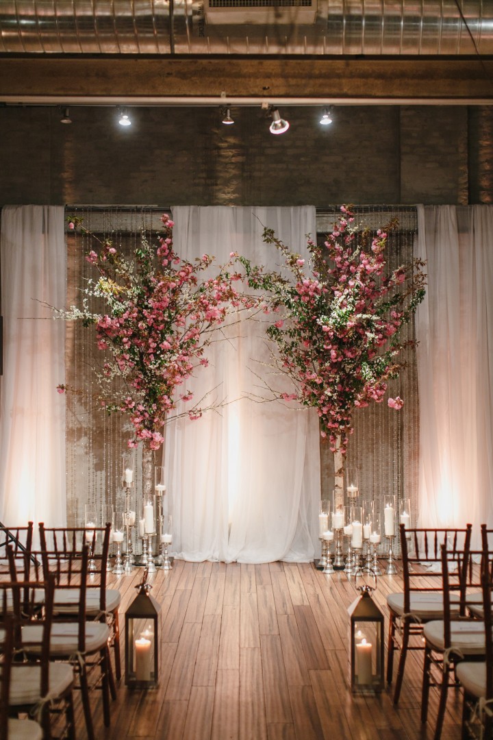 Pink flowers and draping backdrops will set the perfect tone for a classic and romantic indoor wedding ceremony. // ❤ Check Out These Gorgeous 20 Indoor Wedding Ceremony Ideas. // http://mysweetengagement.com/indoor-wedding-ceremony-ideas