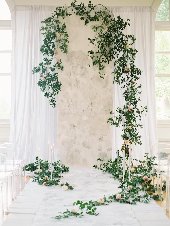 Stunning minimalist indoor wedding ceremony decor with greeneries and white draping. The acrylic chairs make it even more minimal. // ❤ Check Out These Gorgeous 20 Indoor Wedding Ceremony Ideas. // http://mysweetengagement.com/indoor-wedding-ceremony-ideas