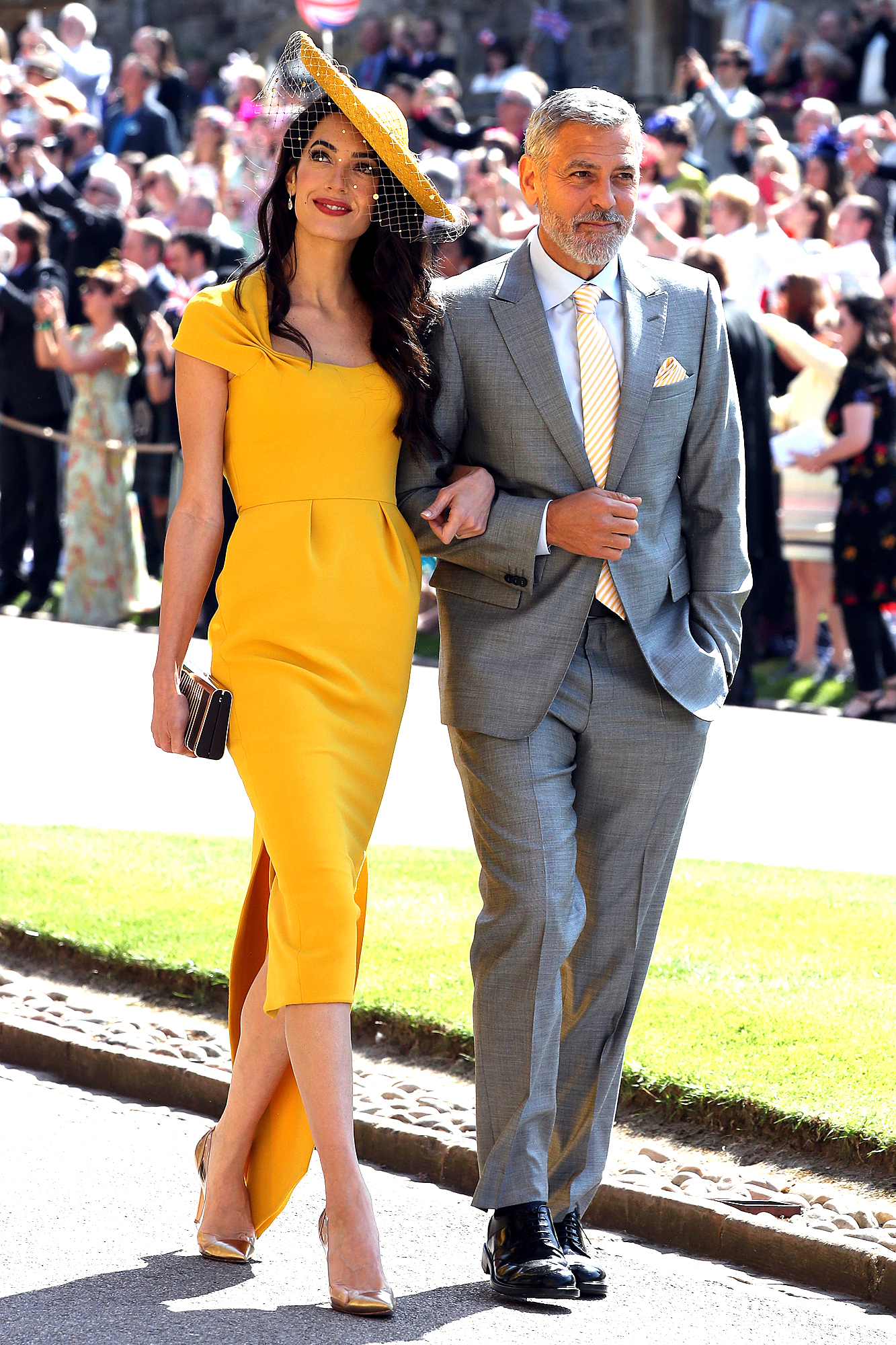 Amal Clooney at Prince Harry and Meghan Markle's Royal Wedding Wearing a Gorgeous Mustard Dress.