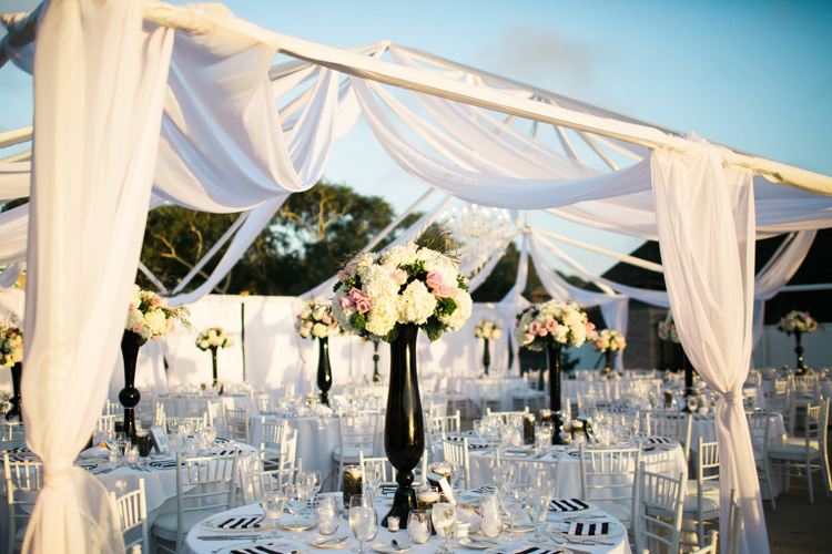 Wedding reception white and black accents with tall floral centerpieces. | More on: https://mysweetengagement.com/alexandra-and-matt-a-californian-proposal/ - SisterLee Photography 