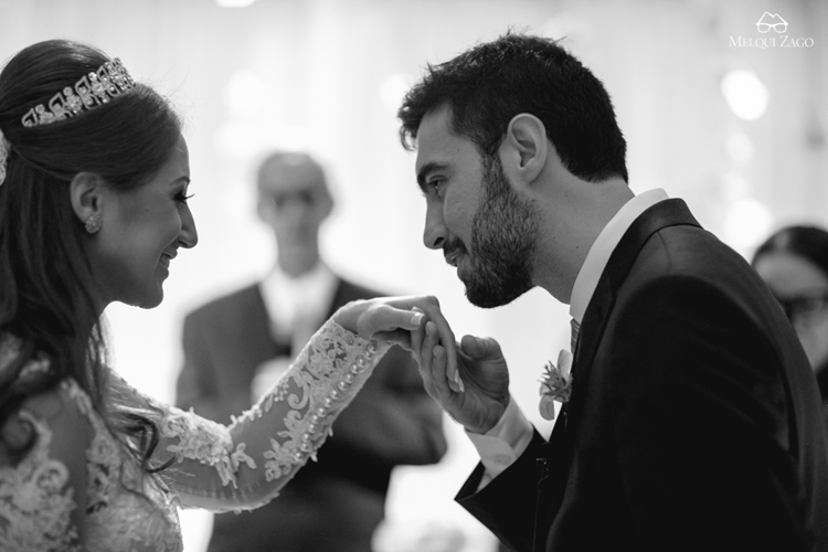 Groom kisses bride's hand | https://mysweetengagement.com/casamento-em-blumenau-joanna-e-rafael