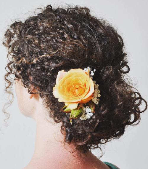 Low bridal updo with yellow flower for natural hair // mysweetengagement.com