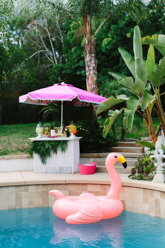 Tropical Bridal Shower Ideas: Pool party essentials - floating flamingo and tiki bar // mysweetengagement.com