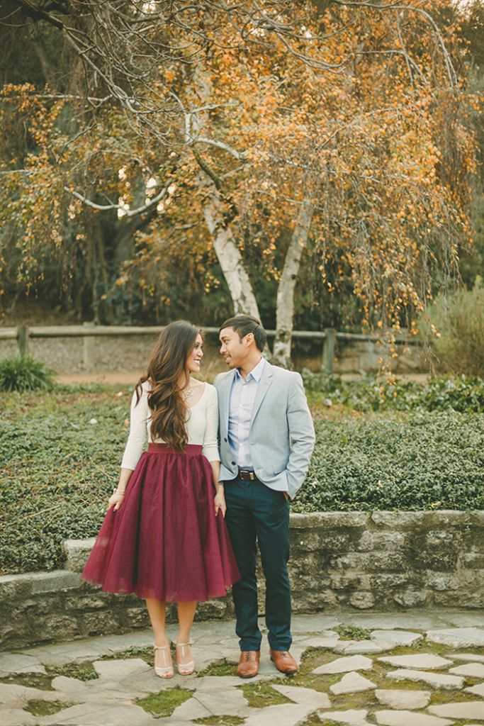 Love the way her burgundy tulle skirt matches the fall foliage. Such a romantic look. Kristen Booth Photography. // Don't know what to wear for your engagement pictures? Check out these 10 Formal Engagement Photo Outfit Ideas. // https://mysweetengagement.com