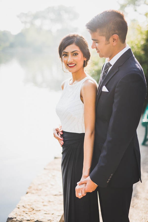 What an elegant couple. Red lips, black and white dress and a hair bun. John Myers Photography. // Don't know what to wear for your engagement pictures? Check out these 10 Formal Engagement Photo Outfit Ideas. // https://mysweetengagement.com