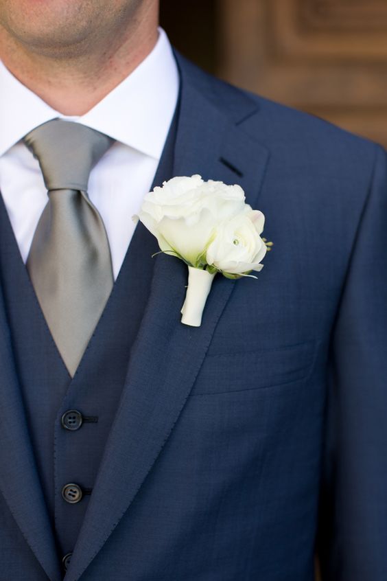 Gallery page with stunning navy blue wedding ideas // Elegant navy blue groom suit with silver tie and white rose boutonniere. // mysweetengagement.com
