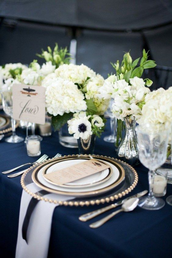 Gallery page with stunning navy blue wedding ideas // Wedding tablescape with navy blue table cloth, white flowers and gold accents. // mysweetengagement.com