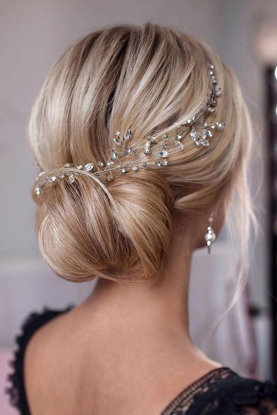 Romantic Bridal Updos // Sophisticated wedding low bun hairstyle idea with magnificent hairpiece. // mysweetengagement.com