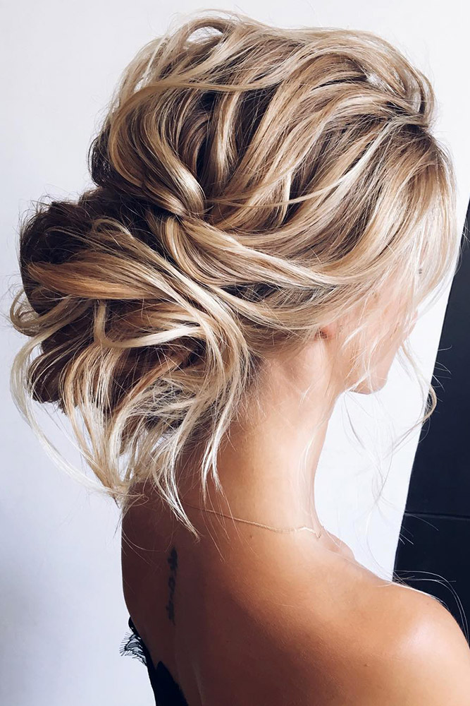  Effortlessly chic and Romantic Bridal Updo with textured soft waves messy bun inspiration for brides-to-be. // mysweetengagement.com