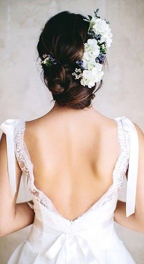 Show off the back of your dress with a beautiful hair bun. Low updo with gorgeous white fresh flowers. 