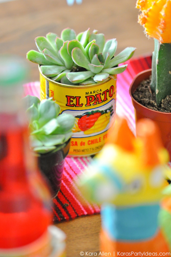 These easy to hack tin can centerpiece can make a big statement for a cinco de mayo themed bridal shower celebration // Get inspired with these Elegant Mexican Fiesta / Cinco de Mayo Themed Bridal Shower Ideas. // mysweetengagement.com