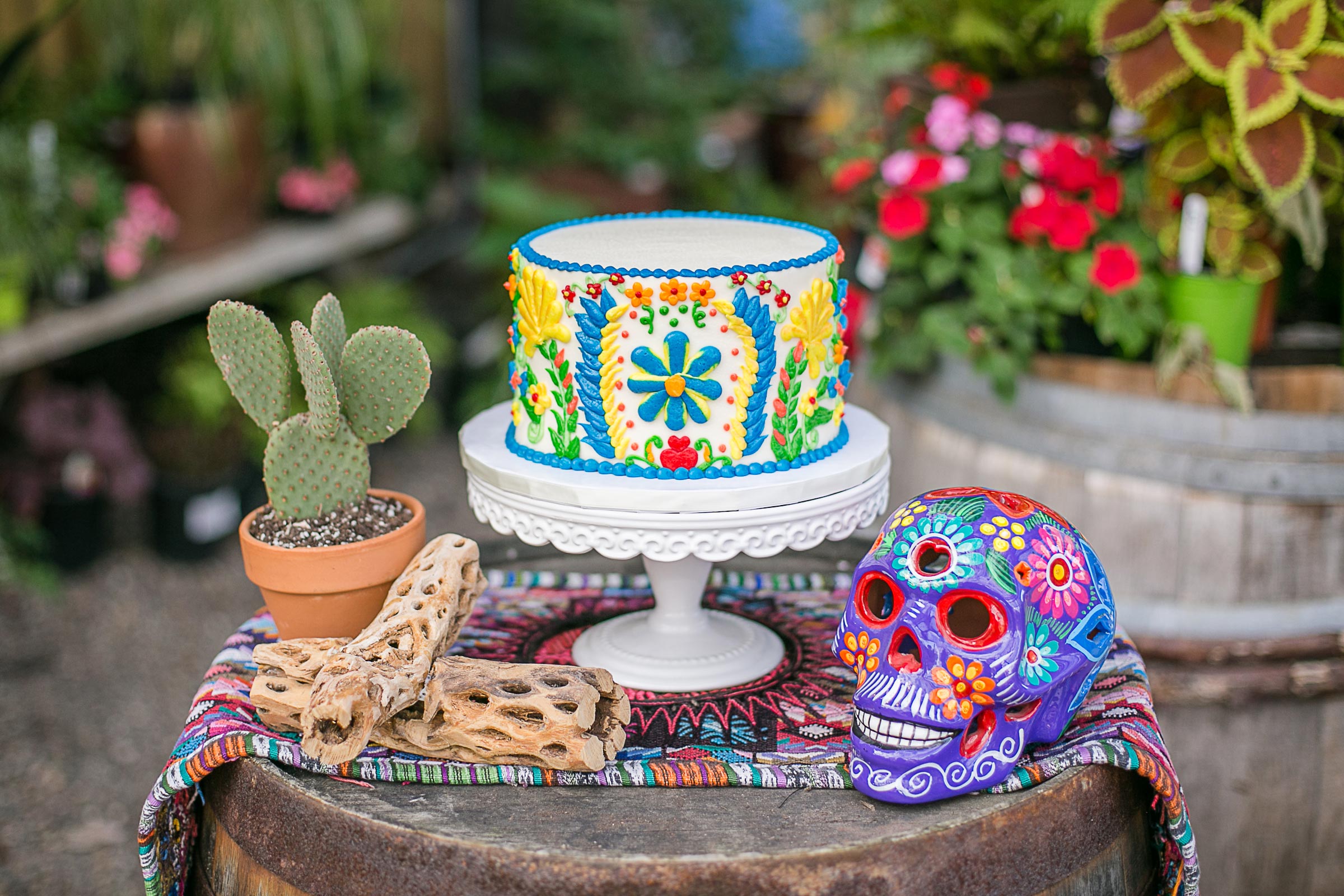 Adorable 5 de Mayo or Dia de Los Muertos themed mini cake inspiration for a fun bridal shower. How adorable is this colorful floral skull and this little cactus? // Get inspired with these Elegant Mexican Fiesta / Cinco de Mayo Themed Bridal Shower Ideas. // mysweetengagement.com