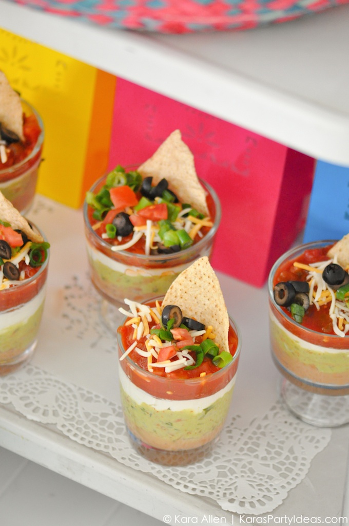 Shot glass layered guacamole and salsa appetizer // Get inspired with these Elegant Mexican Fiesta / Cinco de Mayo Themed Bridal Shower Ideas. // mysweetengagement.com