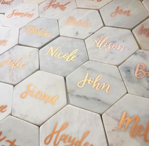 Marble wedding theme ideas: hexagonal marble coaster with gold personalized name calligraphy. // mysweetengagement.com