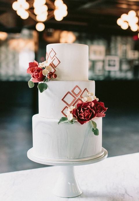 Marble themed wedding ideas: tree tiered white marble wedding cake with rose gold geometric details and red flowers. // mysweetengagement.com