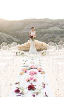 Modern affair: Acrylic wedding decor and ideas. Minimalist outdoor wedding ceremony with perspex ghost-chairs and low pampa grass altar. // mysweetengagement.com