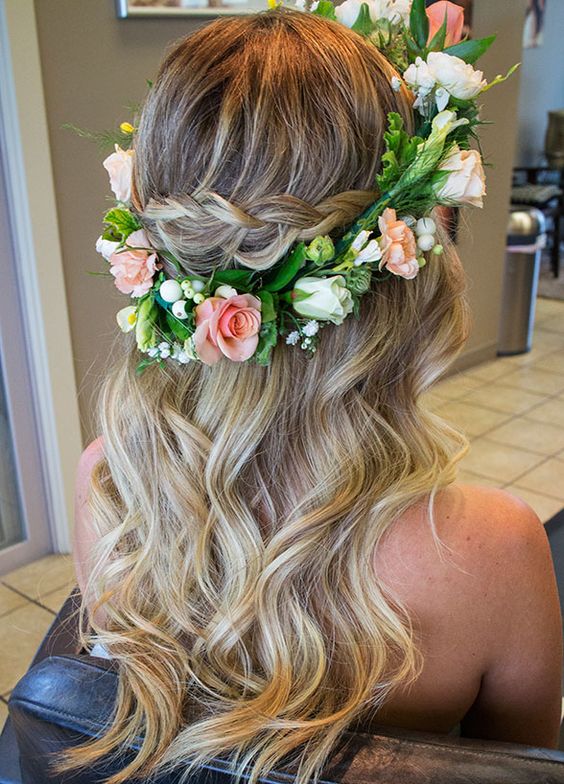 Braided half up half down bridal hairstyle with floral crown piece. // Gorgeous half up half down bridal hairstyle ideas to impress on your wedding day. // mysweetengagement.com