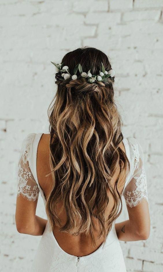 Romantic twisted half up half down hair with greeneries. // Gorgeous half up half down bridal hairstyle ideas to impress on your wedding day. // mysweetengagement.com
