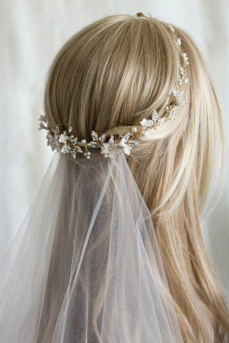 Simple sleek bridal half up half down hairstyle idea with veil. // Gorgeous half up half down bridal hairstyle ideas to impress on your wedding day. // mysweetengagement.com