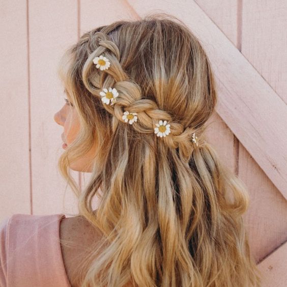 Romantic Boho style braided half up half down hairstyle idea with delicate daisies. // Gorgeous half up half down bridal hairstyle ideas to impress on your wedding day. // mysweetengagement.com